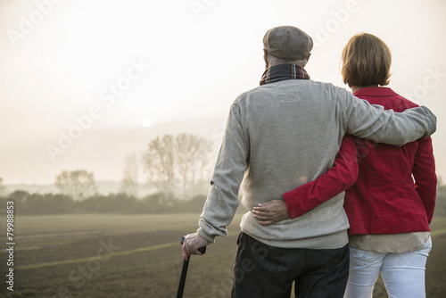 Senior man and daughter in rural landscape