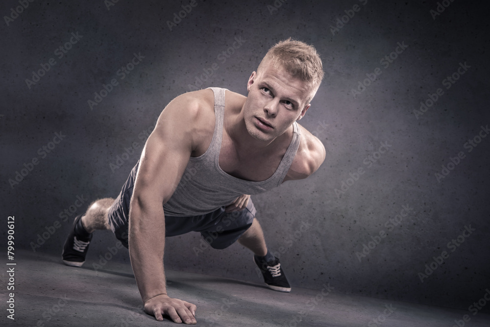 Young man doing push-ups Young man doing push-ups