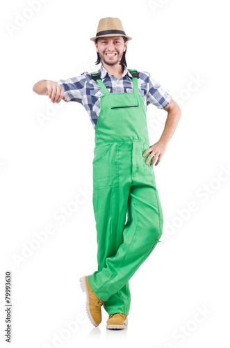 Young cheerful gardener in hat and green uniform isolated on