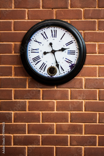 clock on the brick wall