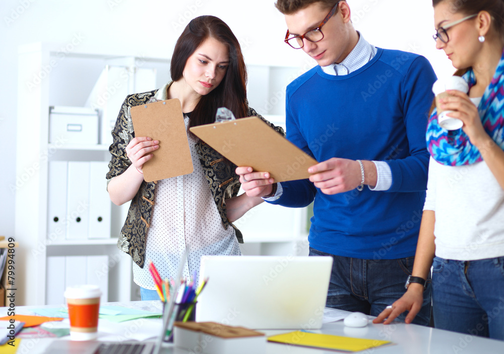 Young business people working at office on new project Young business people working at office on new project