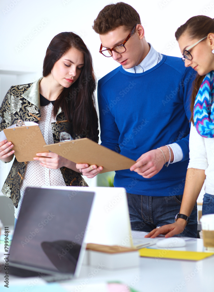 Young business people working at office on new project Young business people working at office on new project