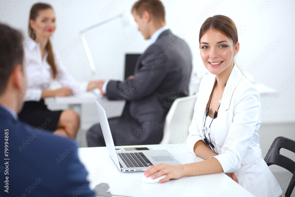 Business people sitting and discussing at business meeting Business people sitting and discussing at business meeting