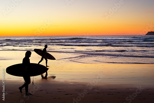 Surfers at sunset, Portugal