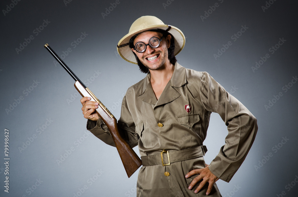 Funny safari hunter with rifle