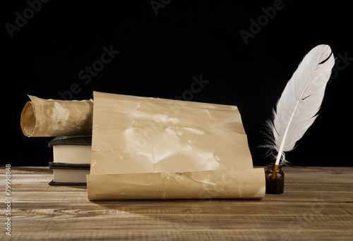old paper, books and feather