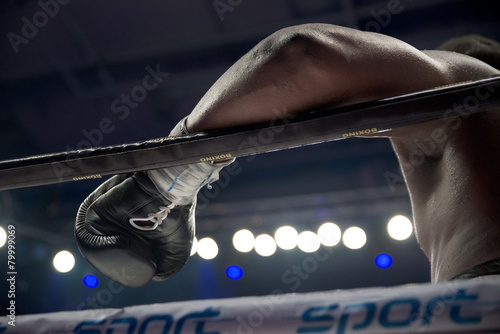 Detail of boxer's hand on the rope after the true fight photo