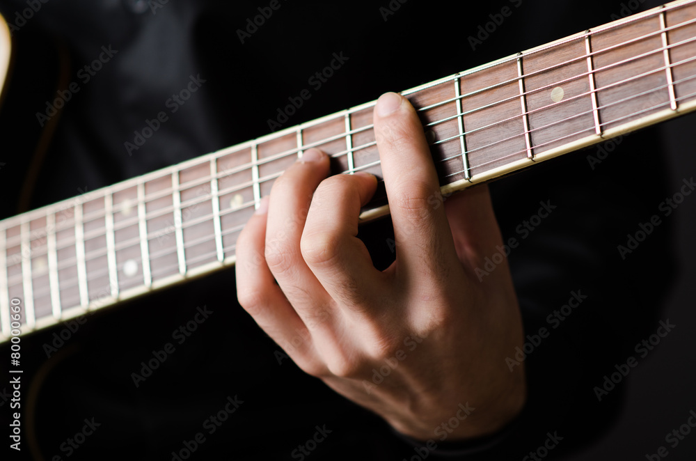 Man with guitar during concert Man with guitar during concert
