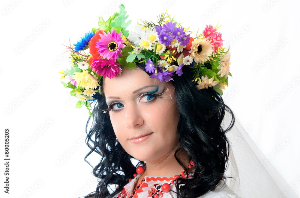 Ukrainian girl with colorful corolla on the head