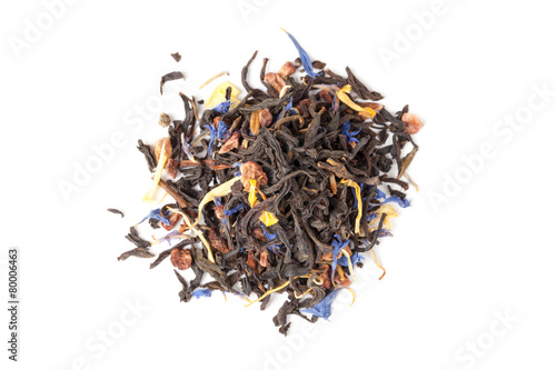 Black tea mixed with herbs and fruits, isolated. Top view