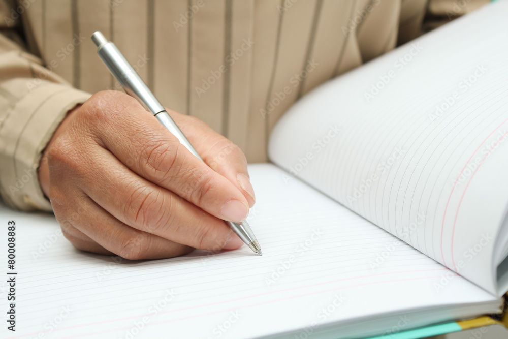 Makes a note in notebook. Makes a note in notebook.