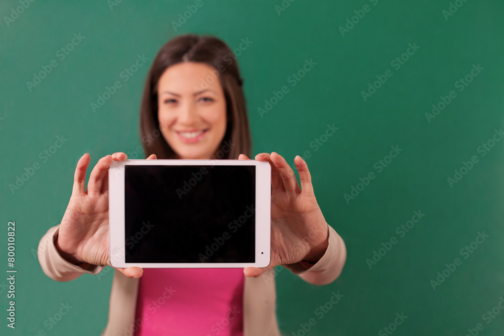 Beautiful woman showing a tablet Beautiful woman showing a tablet