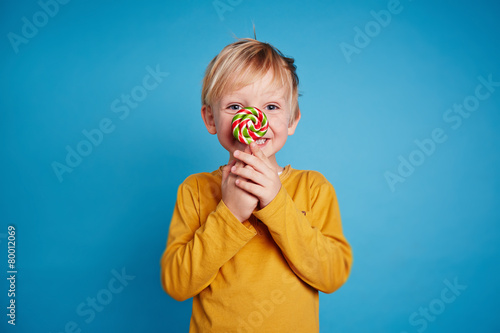 Boy with lollipop photo