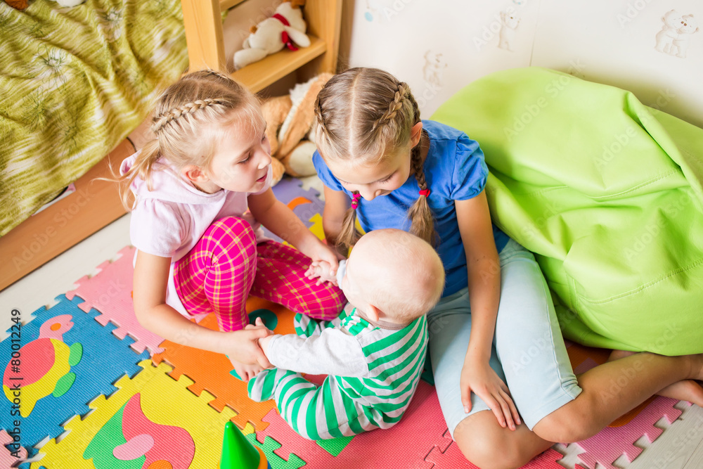 Fototapeta premium Happy kids playing with little brother