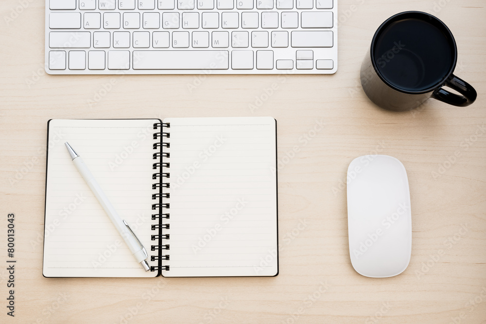 Keyboard and blank note book on the desk. Keyboard and blank note book on the desk.