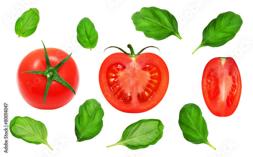 Fresh red tomatoes and basil leaves on isolated white backround