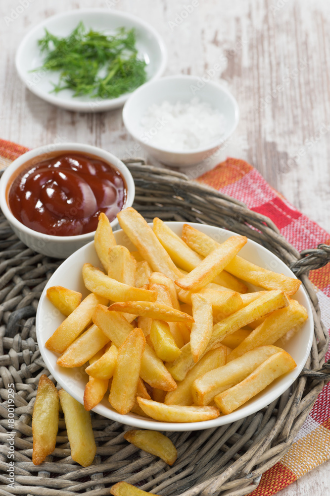 fried french fries with tomato sauce, vertical fried french fries with tomato sauce, vertical