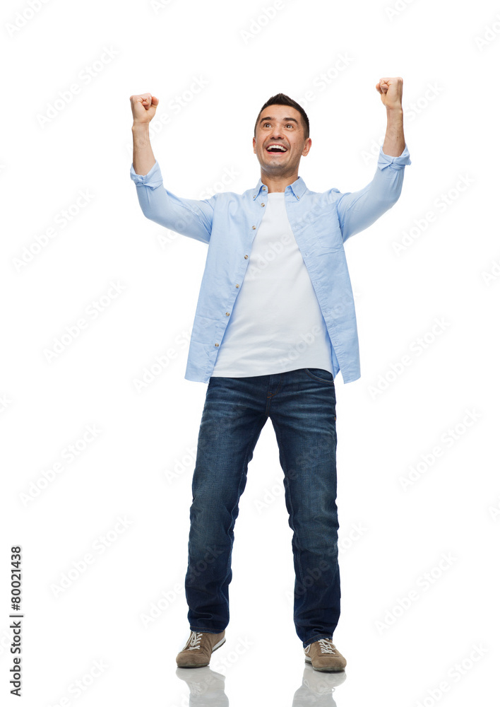 happy laughing man with raised hands happy laughing man with raised hands