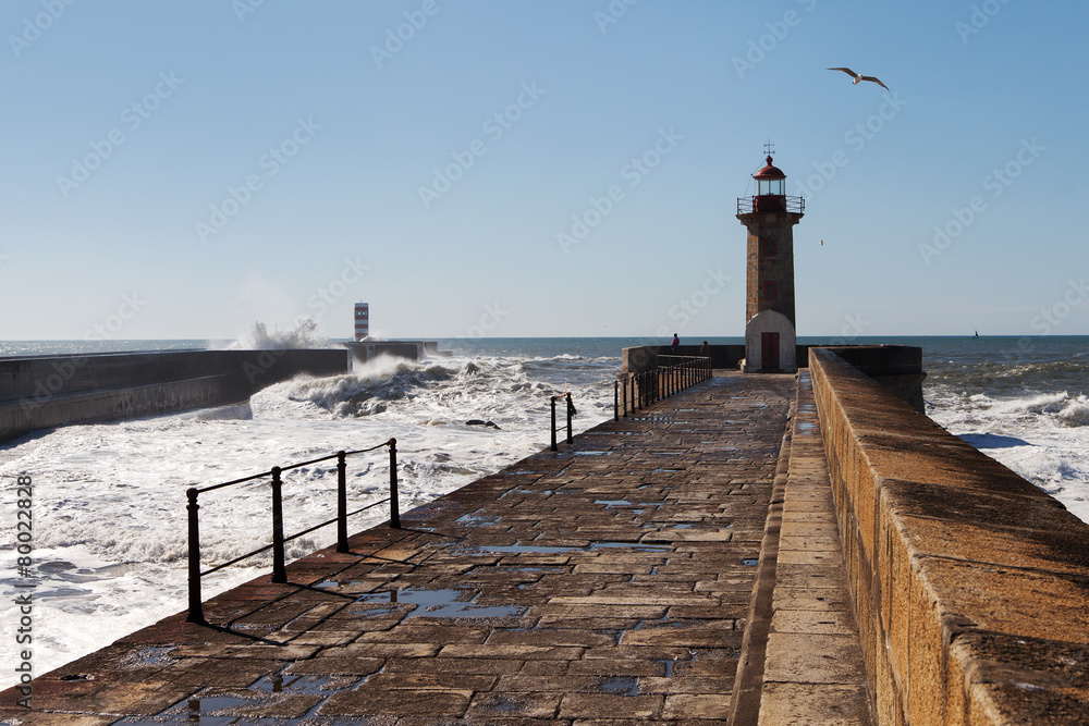 Waves on brekwater in Porto, Portugal.