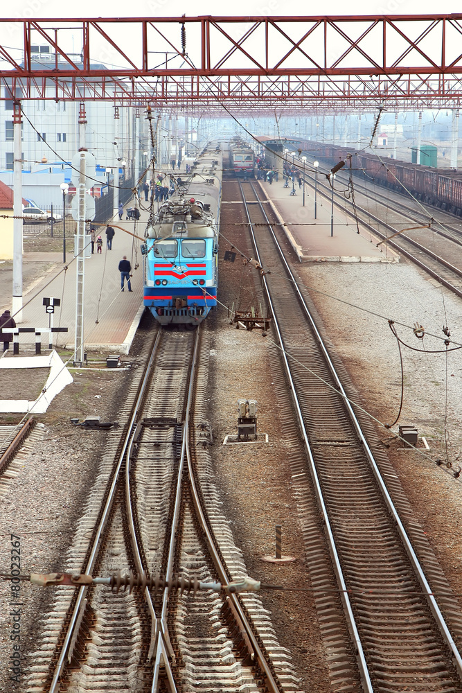 Passenger train standing on the station platform,