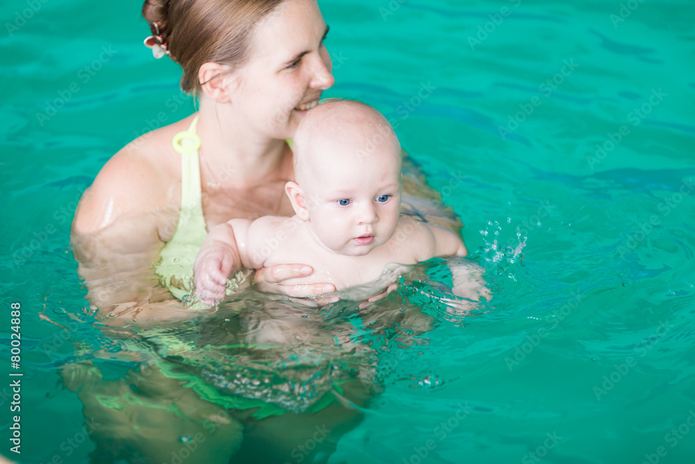 Mother with baby in swimming pool Mother with baby in swimming pool