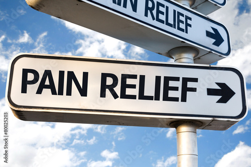 Pain Relief direction sign on sky background photo