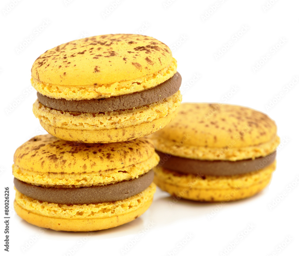 close up of colorful macarons over white background close up of colorful macarons over white background