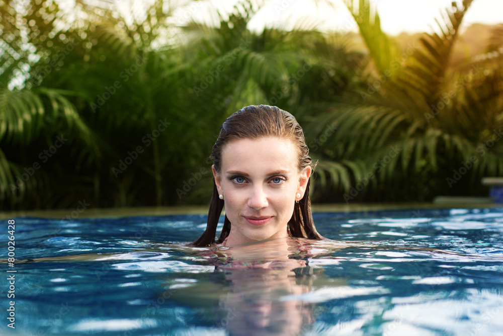 Sexy woman swimming in pool
