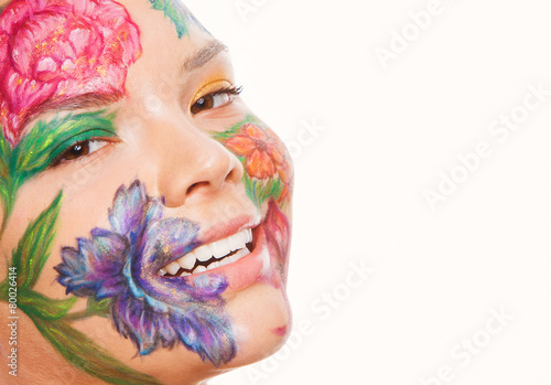 Close up portrait of woman model with hand drawing flowers on