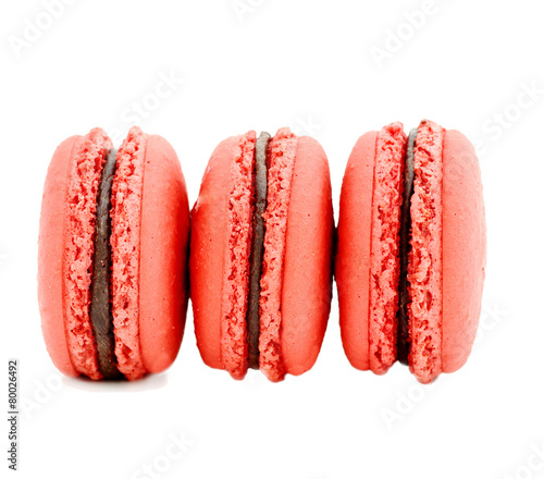 close up of colorful macarons over white background photo