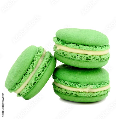 colorful macaroons over white background