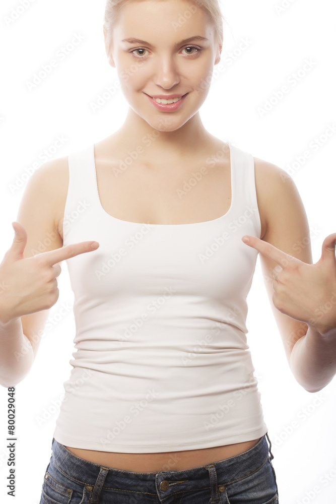 young woman in blank white t-shirt showing at herself young woman in blank white t-shirt showing at herself