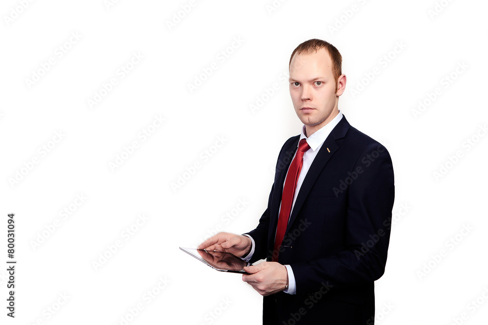Successful CEO works on tablet computer on an isolated white bac Successful CEO works on tablet computer on an isolated white bac