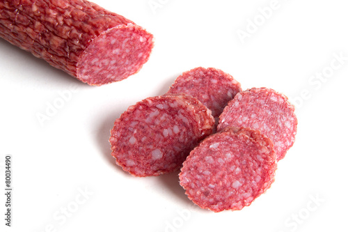 Sliced sausage on a white background