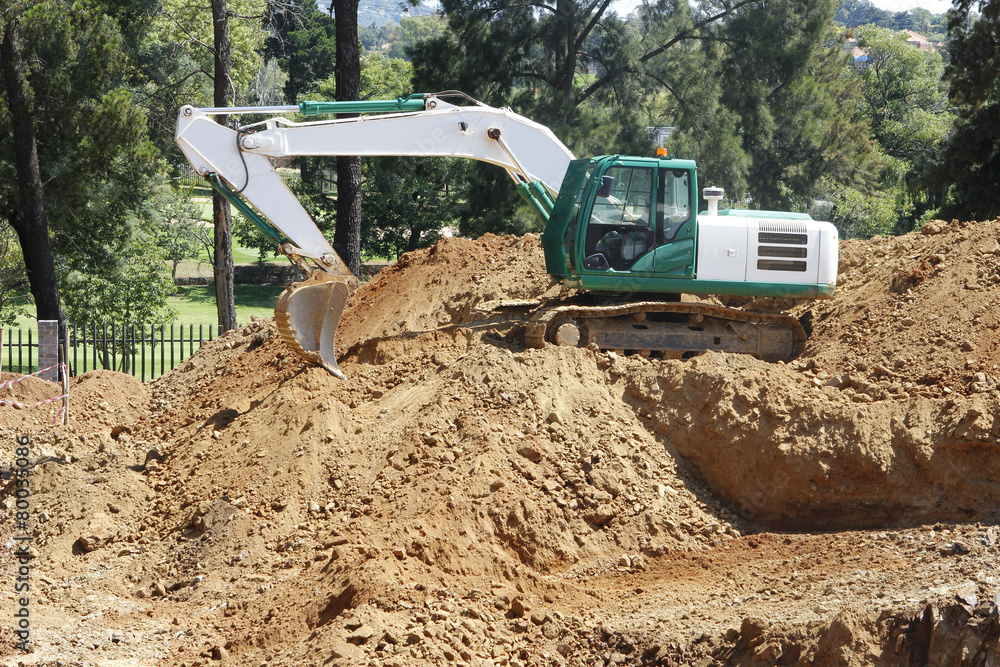Excavator working on a construction site Excavator working on a construction site