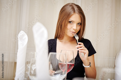 Lovely young woman posing during lunch