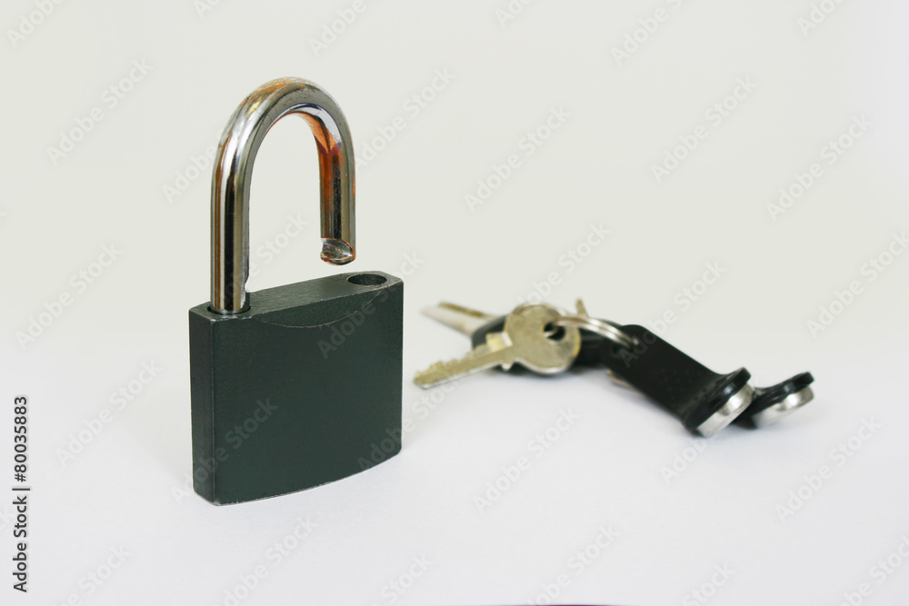 standing lock with a bunch of keys on a white background standing lock with a bunch of keys on a white background