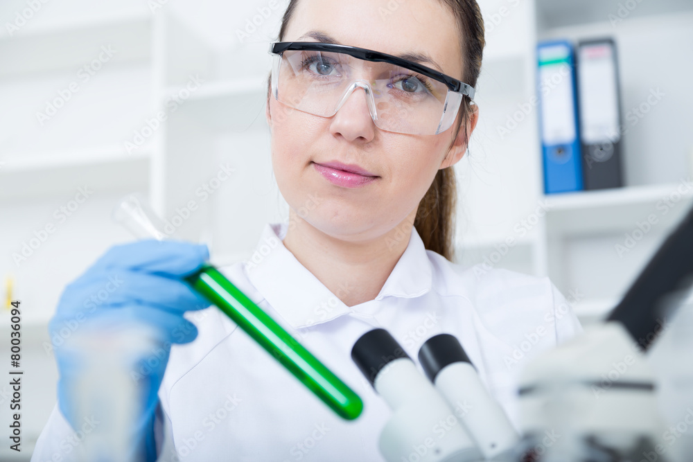 laboratory assistant analyzing a sample laboratory assistant analyzing a sample