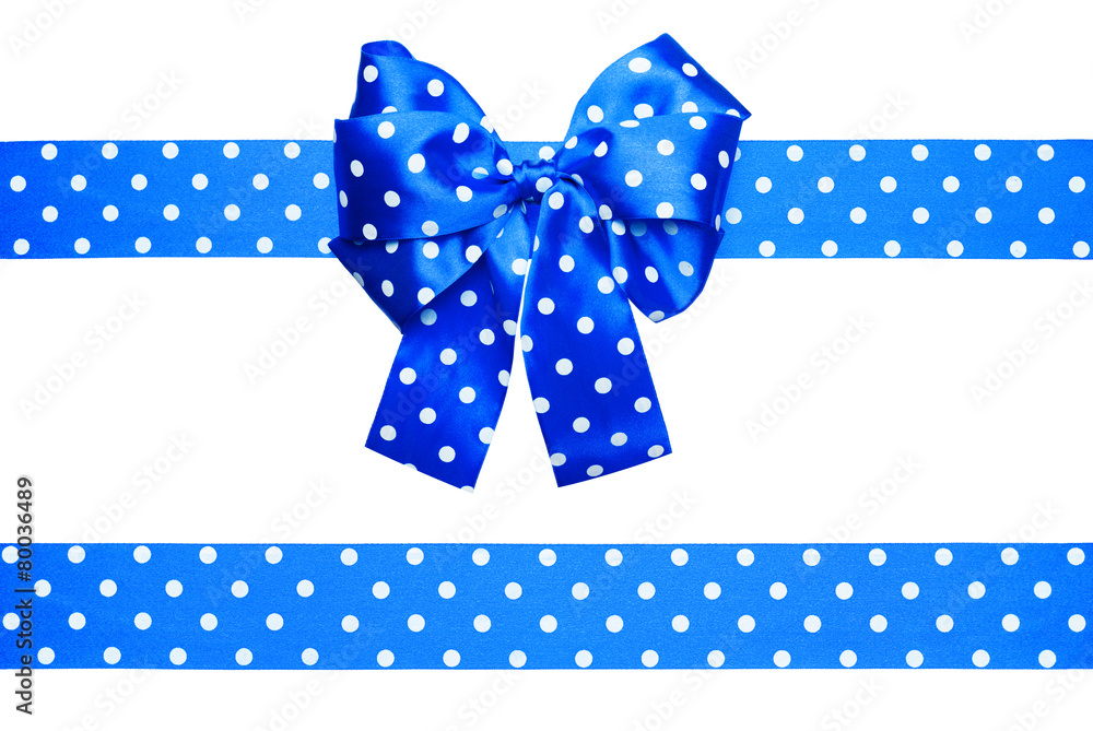blue bow and ribbon with white polka dots made from silk blue bow and ribbon with white polka dots made from silk