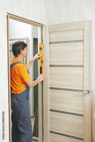 Carpenter works with level