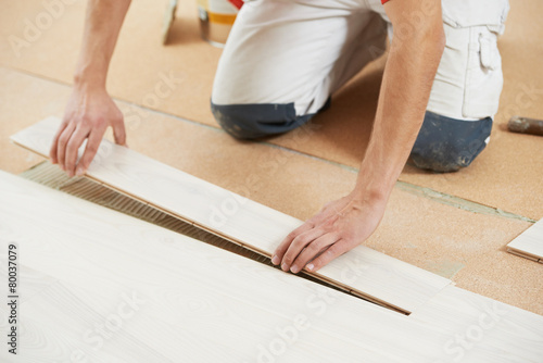 Parquet Floor worker with wood board