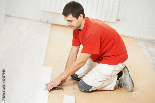 Parquet Floor worker with wood board