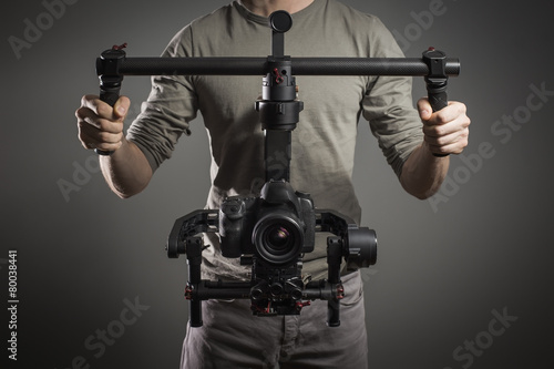 Professional videographer with gimball video slr photo