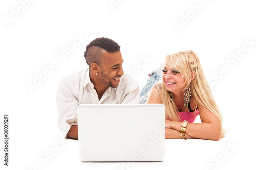 Smiling couple with notebook over white isolated background