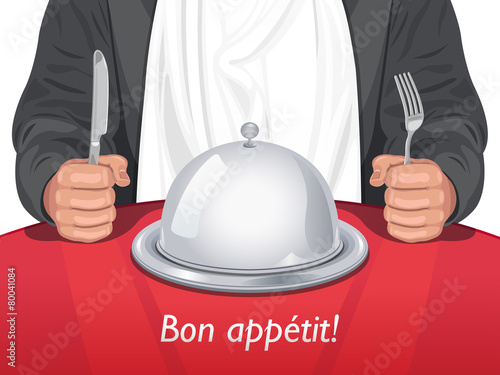 Man with Cutlery with Cloche Dome on the Table in front of Him