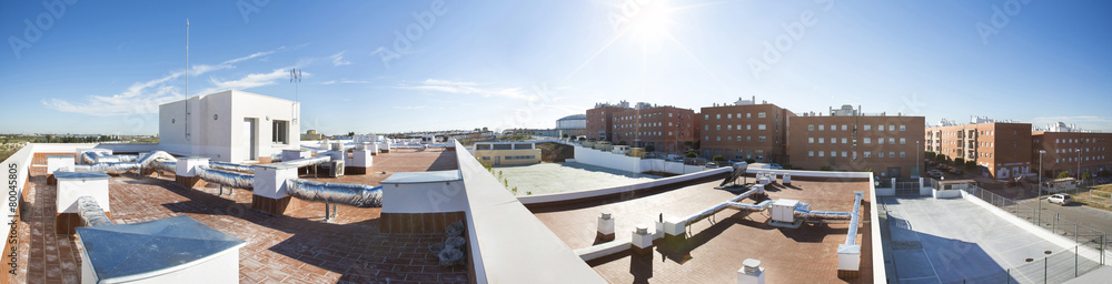 View on the roof of a building of a large air conditioning equip View on the roof of a building of a large air conditioning equip