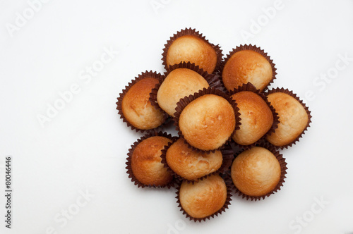 Cupcakes in decorative arrangement on white background