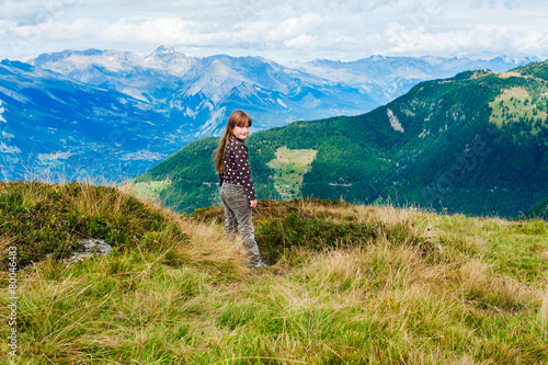 Adorable little girl on the top of the mountain © annanahabed