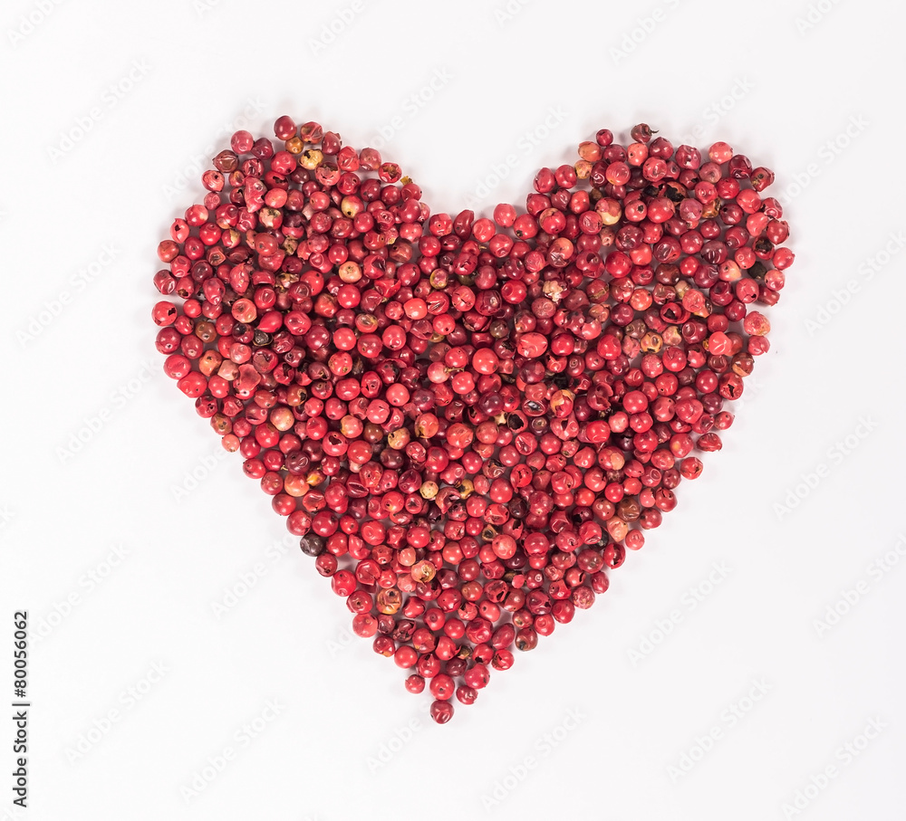 isolated heart laid out from the red peppercorns