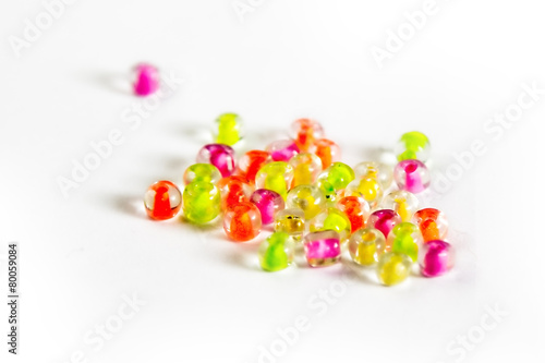 a handful of beads isolated on white background